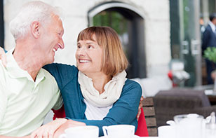 Senior couple smiling at each other